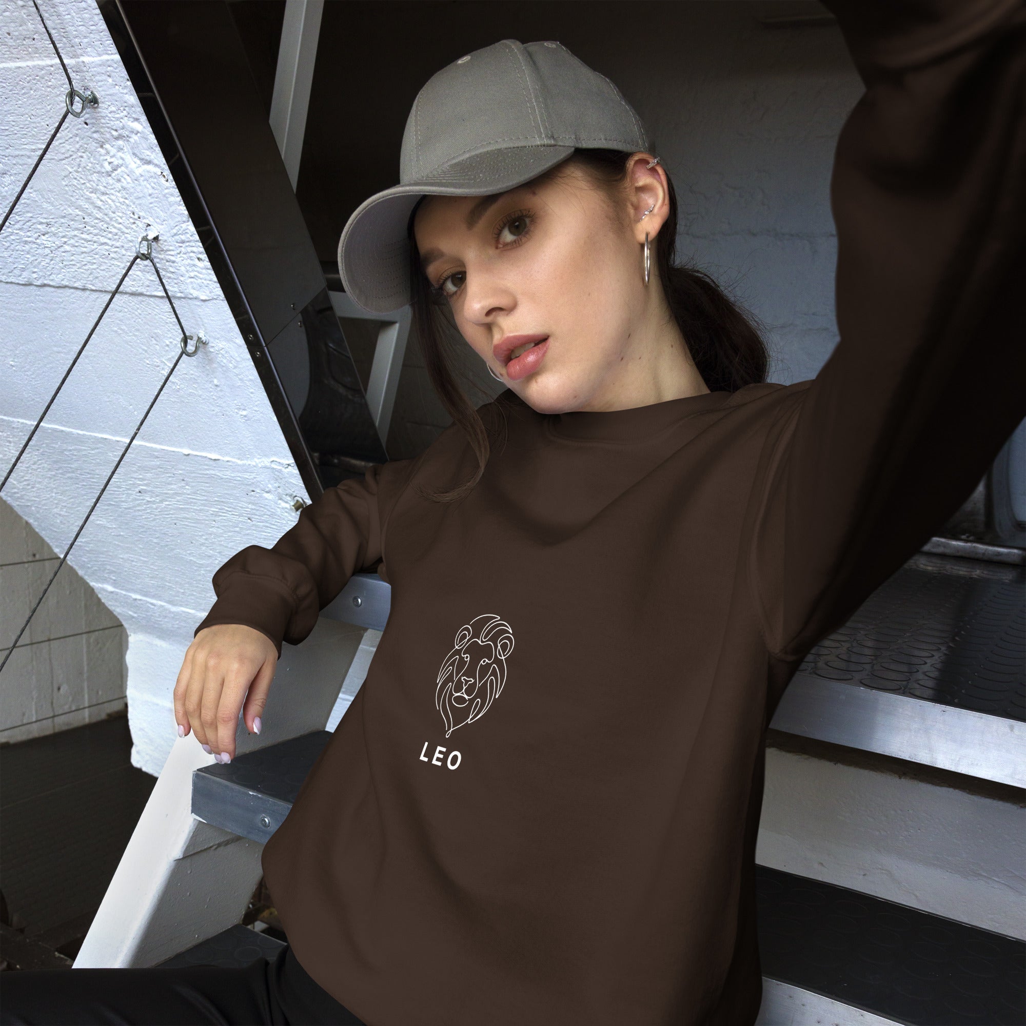 The Leo Mark sweatshirt: white line art lion on a dark unisex crewneck, Leo zodiac