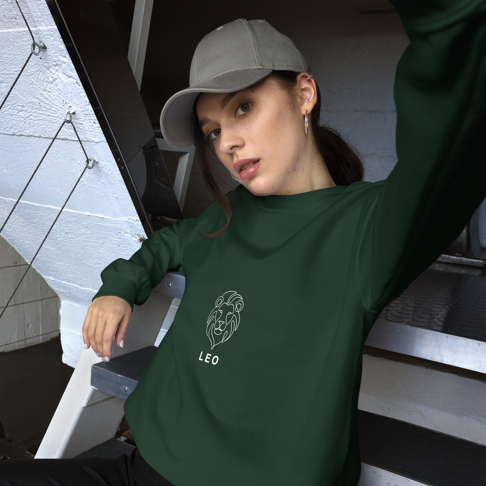 The Leo Mark sweatshirt: white line art lion on a dark unisex crewneck, Leo zodiac