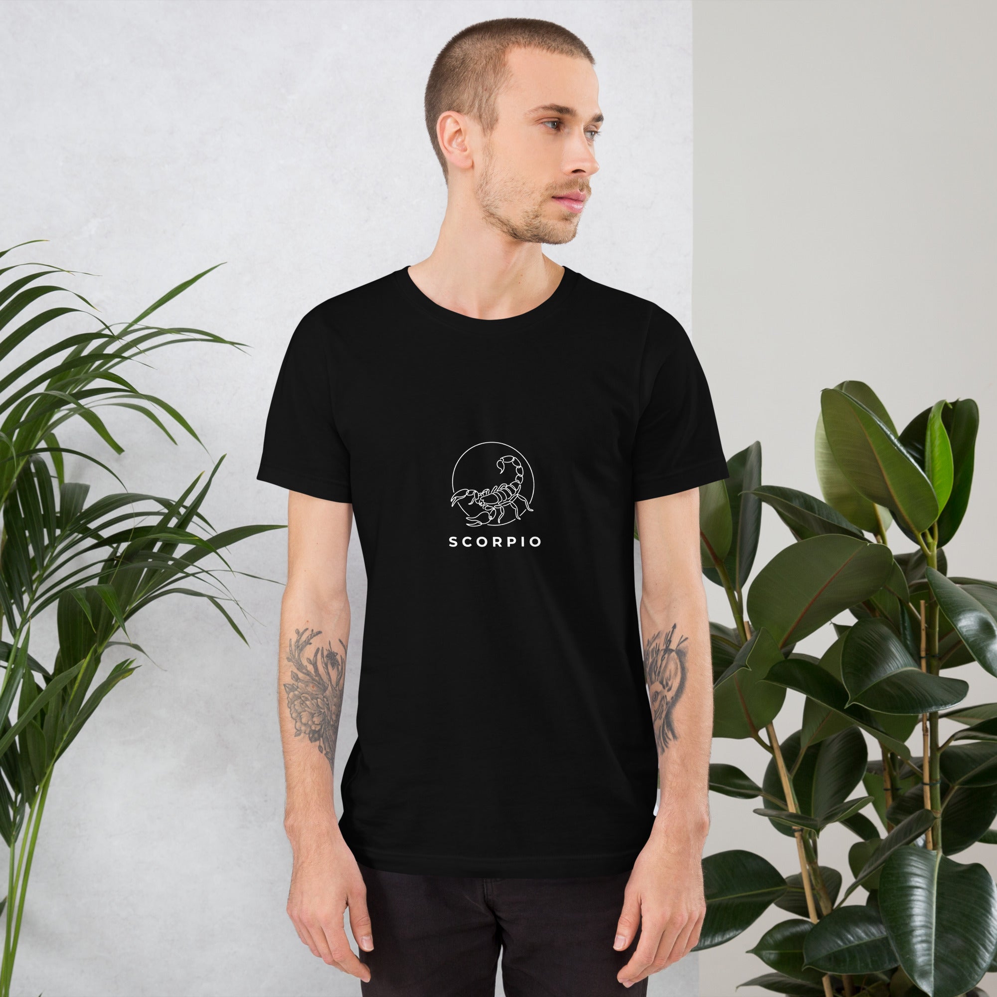 Moonlit Sting tee: white line art scorpion beneath a moon on a dark unisex Scorpio t-shirt