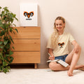 Blaze Ram tee: flaming ram horns in black and orange on a unisex Aries t-shirt